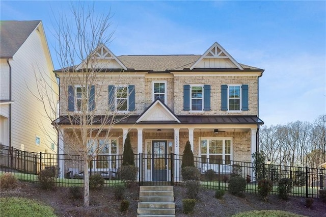 view of front of home featuring fence, covered porch, and brick siding