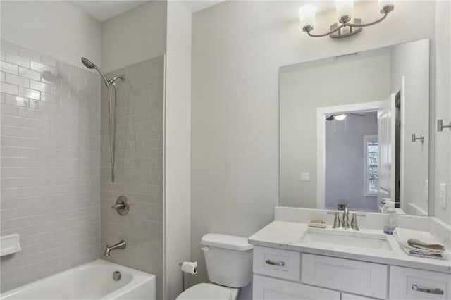 full bath with vanity, toilet, and bathtub / shower combination