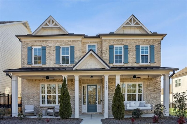 view of front facade with ceiling fan, fence, an outdoor hangout area, brick siding, and a porch
