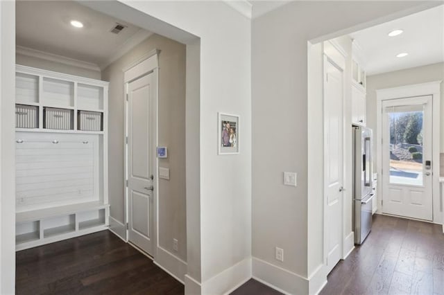 mudroom with visible vents, ornamental molding, baseboards, recessed lighting, and dark wood finished floors