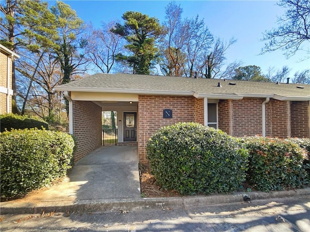 exterior space with a carport