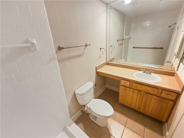 bathroom with tile patterned floors, vanity, and toilet