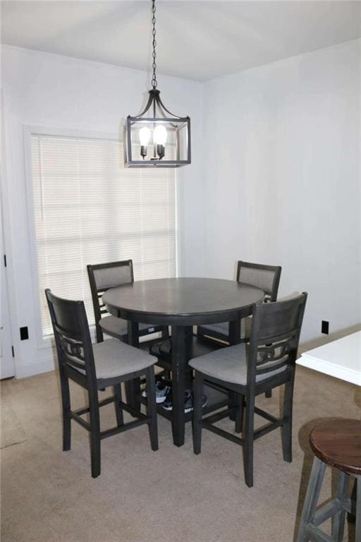 view of carpeted dining area