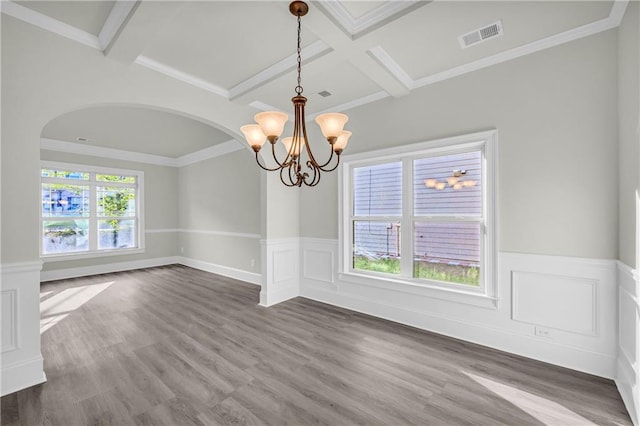 unfurnished room featuring coffered ceiling, dark hardwood / wood-style floors, a notable chandelier, crown molding, and beam ceiling