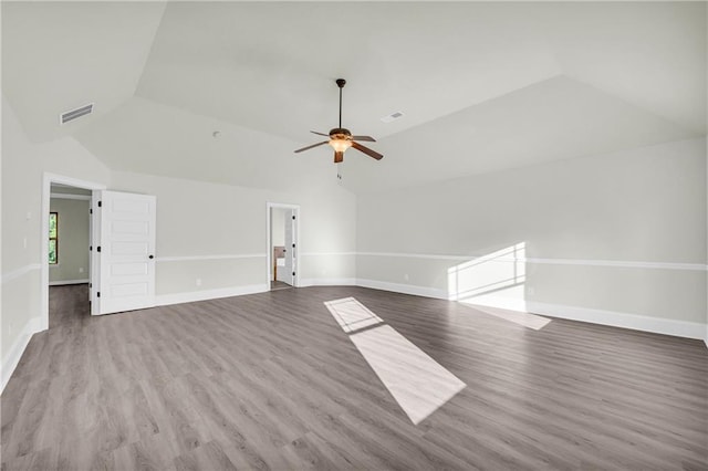 interior space with hardwood / wood-style flooring, ceiling fan, and vaulted ceiling