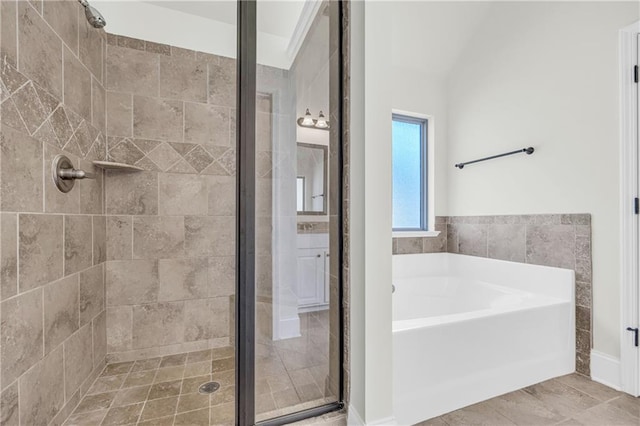 bathroom featuring tile flooring and shower with separate bathtub