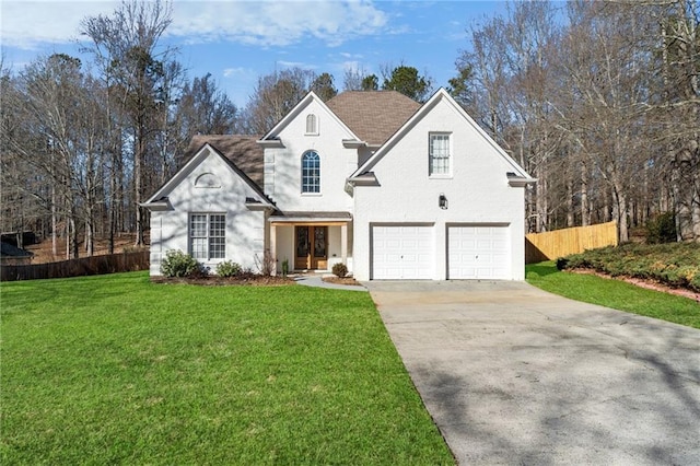 front facade featuring a front yard and a garage