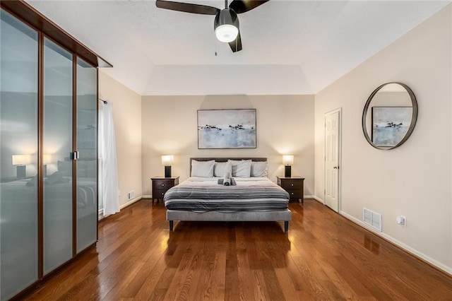 bedroom featuring ceiling fan and dark hardwood / wood-style flooring