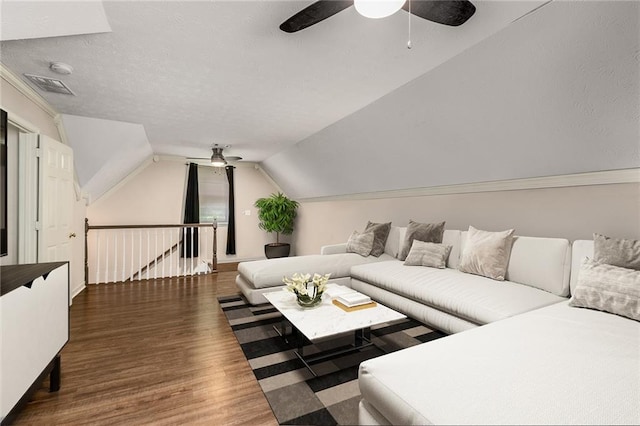 living room with lofted ceiling, ceiling fan, and dark hardwood / wood-style flooring