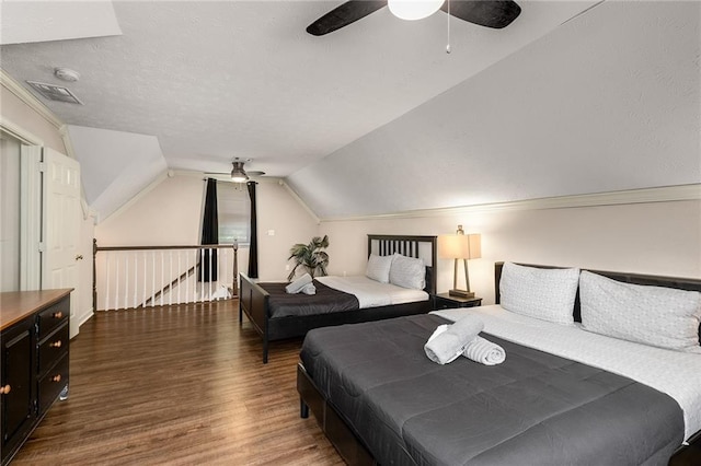 bedroom featuring vaulted ceiling, ceiling fan, and dark hardwood / wood-style floors