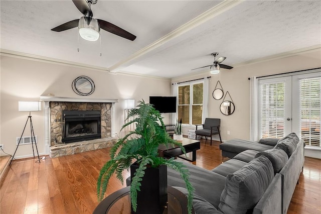 living room featuring wood-type flooring and ceiling fan