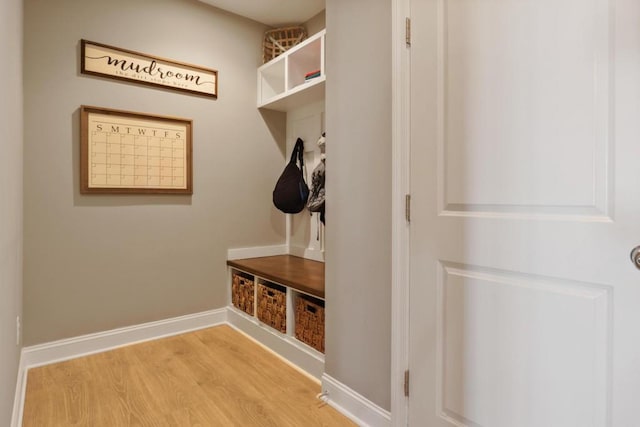 mudroom featuring light wood-type flooring and baseboards