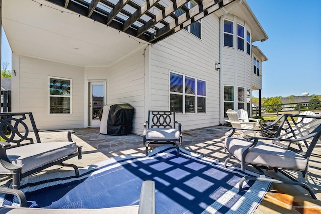 exterior space with a pergola and fence