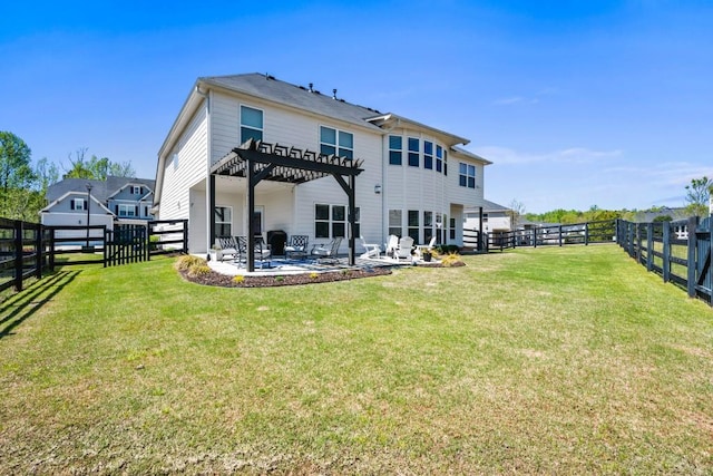 rear view of house with a pergola, a patio, a fenced backyard, and a lawn