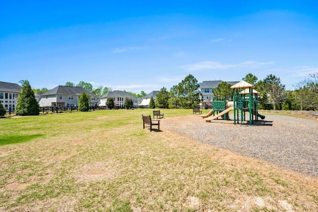 community play area with a residential view and a lawn