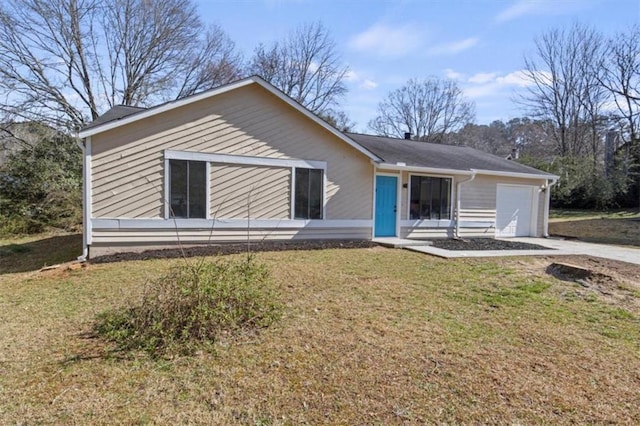 ranch-style house with an attached garage, concrete driveway, and a front yard