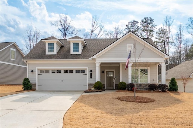 view of front facade with a garage and a porch