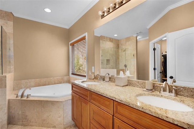 full bath with a sink, a shower stall, and crown molding