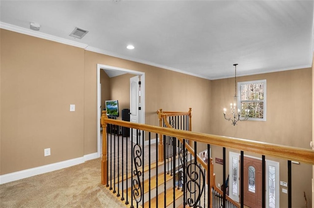 hallway featuring an upstairs landing, carpet, an inviting chandelier, crown molding, and baseboards