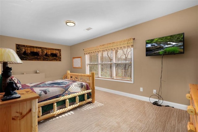 bedroom featuring carpet flooring, visible vents, and baseboards