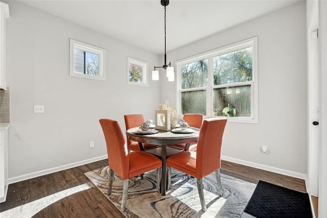 dining space featuring dark hardwood / wood-style floors