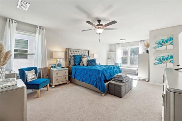 carpeted bedroom featuring ceiling fan