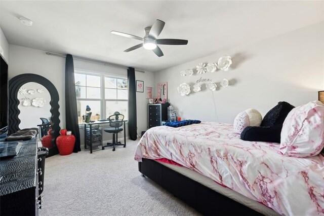 carpeted bedroom with ceiling fan