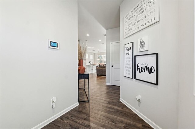 corridor featuring dark wood-type flooring