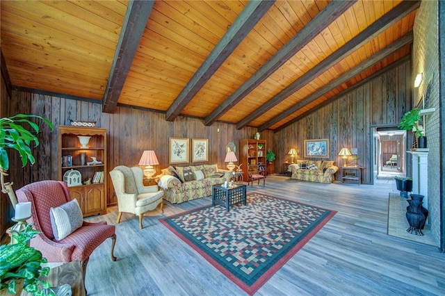 living room featuring wood ceiling, wood-type flooring, and beam ceiling