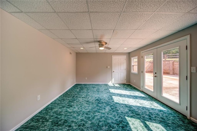 carpeted spare room with french doors