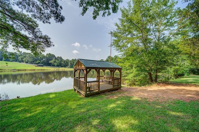 dock area with a yard, a gazebo, and a water view