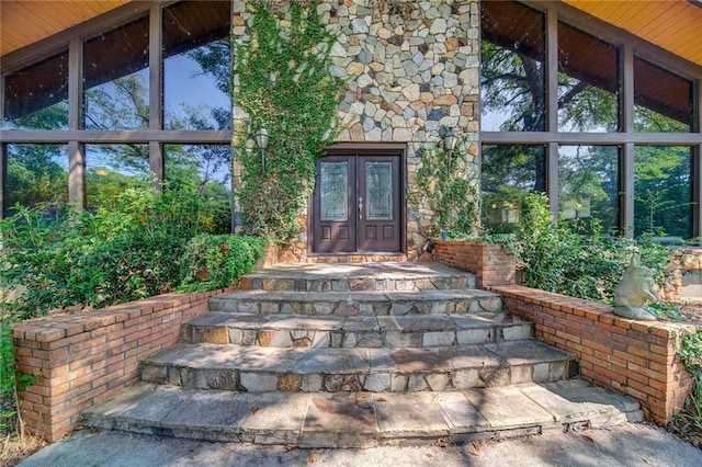 property entrance featuring french doors