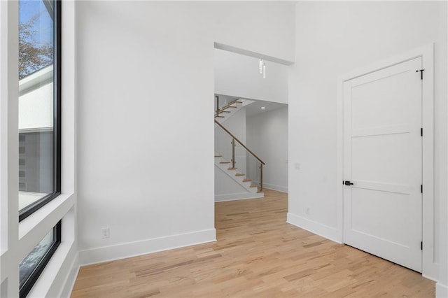 unfurnished room with light hardwood / wood-style floors