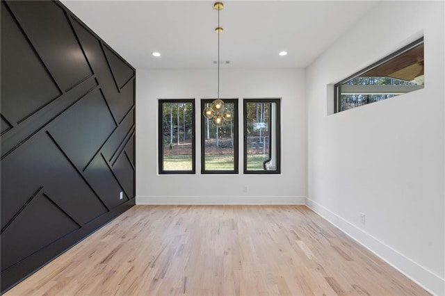 unfurnished dining area featuring light hardwood / wood-style floors