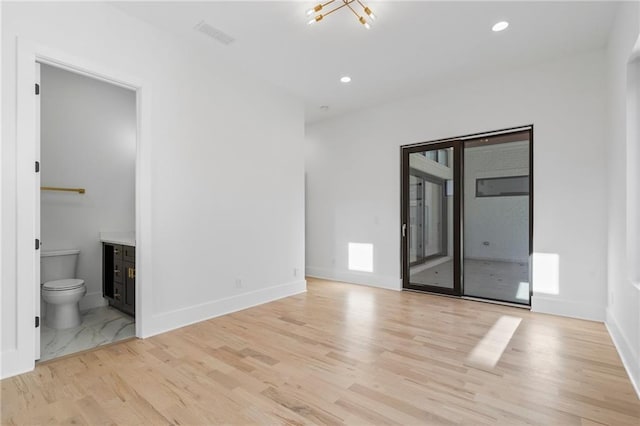 unfurnished room featuring light wood-type flooring