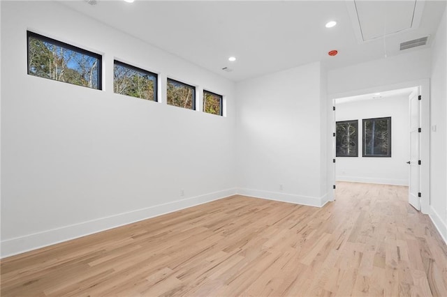 unfurnished room with light hardwood / wood-style floors