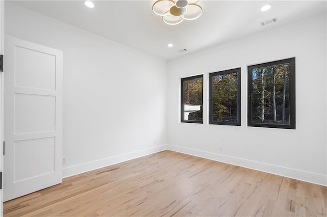 unfurnished room featuring light wood-type flooring