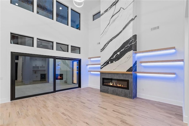 unfurnished living room featuring hardwood / wood-style flooring