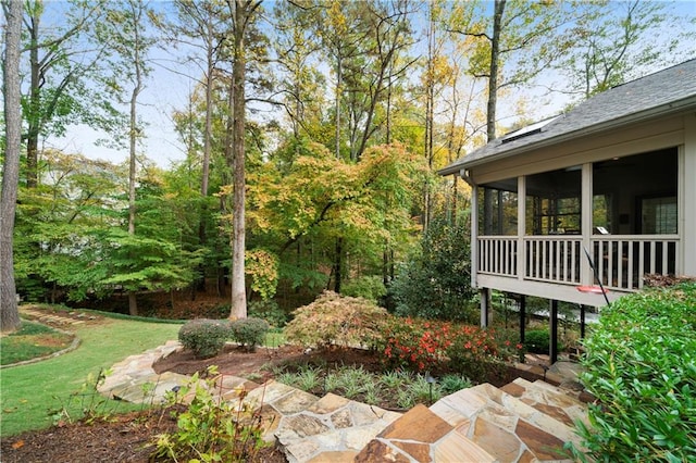 view of yard with a sunroom