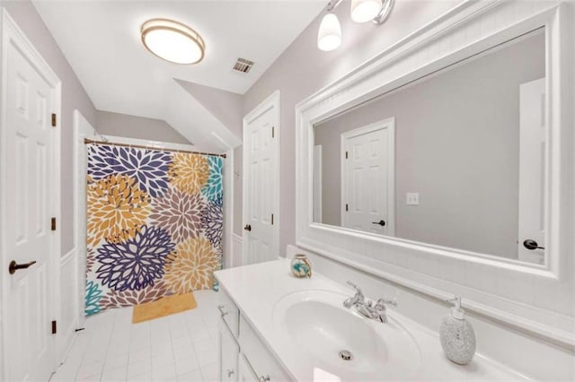 full bathroom featuring vanity, tile patterned floors, and a shower with shower curtain