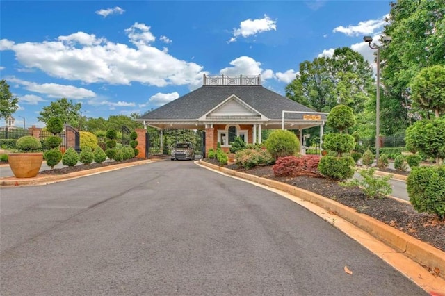 view of property with driveway and a carport