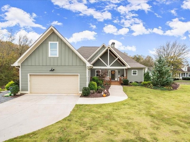 craftsman house featuring a front yard and a garage