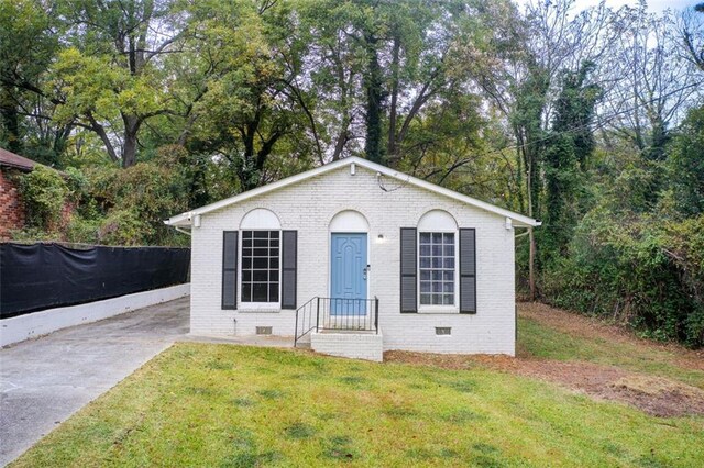 1351 Eason St NW, Atlanta, GA 30314 - view of front of property featuring crawl space, a front lawn, and brick siding