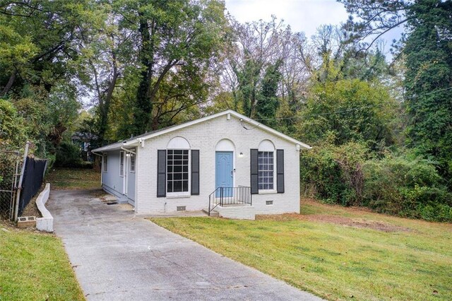 1351 Eason St NW, Atlanta, GA 30314 - view of front of property with concrete driveway, brick siding, crawl space, and a front lawn