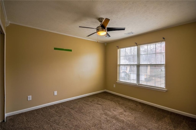 carpeted empty room with ceiling fan, ornamental molding, and a textured ceiling