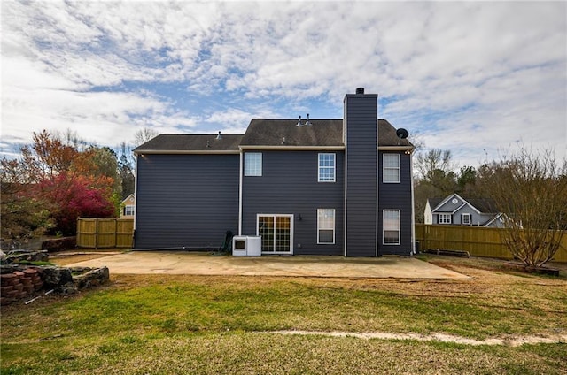 back of property featuring ac unit, a yard, and a patio area