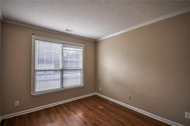 unfurnished room with ornamental molding, dark hardwood / wood-style floors, and a textured ceiling