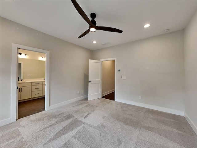 unfurnished bedroom featuring a ceiling fan, baseboards, carpet floors, recessed lighting, and connected bathroom