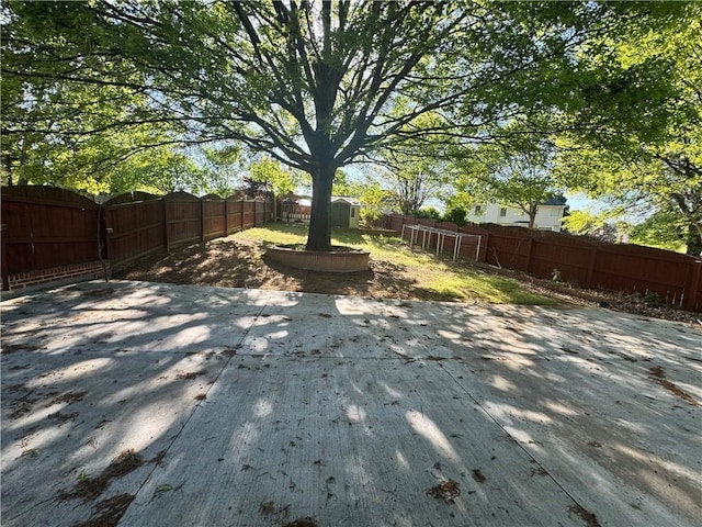 1417 Wind Chime Ct, Lawrenceville, GA 30045 - fenced backyard featuring a patio and a storage unit