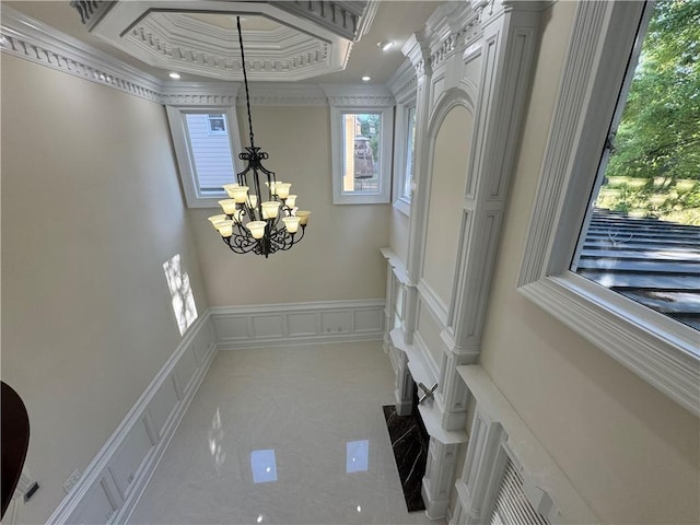 1417 Wind Chime Ct, Lawrenceville, GA 30045 - entryway with crown molding, a chandelier, and a decorative wall